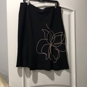 Cute flirty black skirt with beaded flower